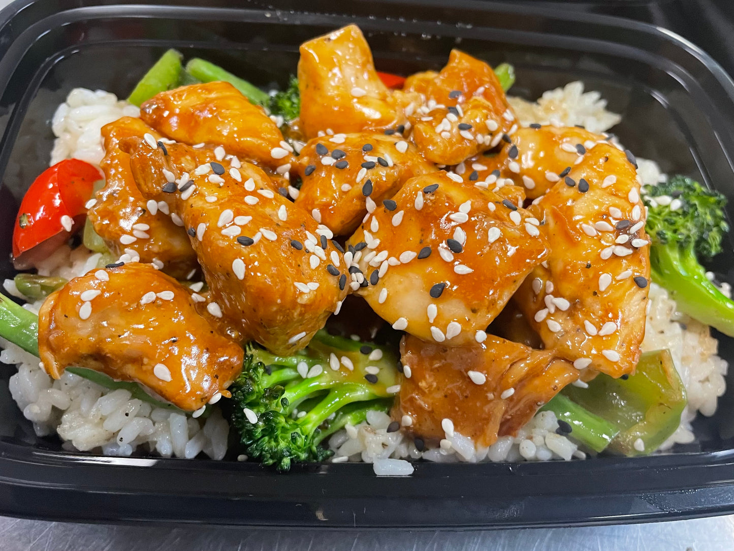 Sesame chicken over white rice with stir fry vegetables (Gluten-free)