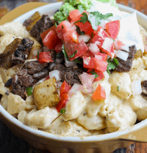 Carne asada over high protein smoky mac-n-cheese with fresh pico de gallo & steamed broccoli