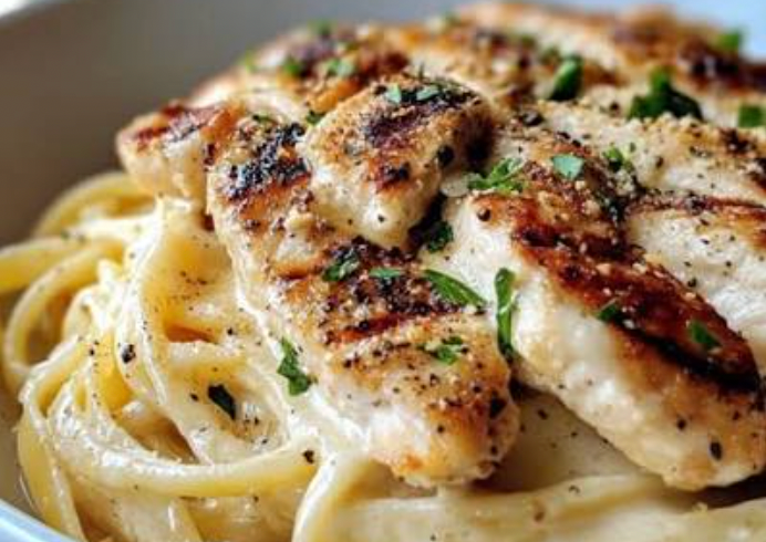 Fettuccine alfredo with grilled chicken tenders (Italian-imported pasta)
