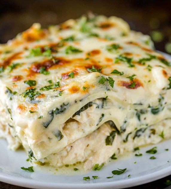 White lasagna over spinach