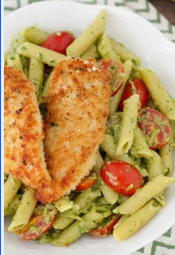 Italian pasta with pesto sauce topped with grilled chicken tenders