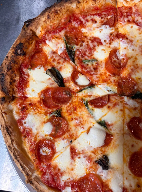 Thin crust margherita pizza with turkey pepperoni