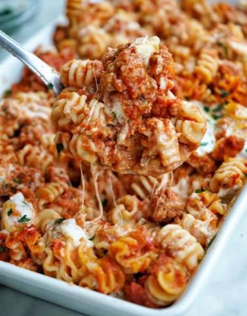 High protein cheesy lasagna pasta served over fresh spinach
