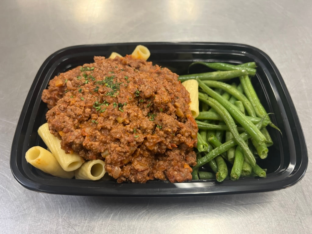 Ground beef bolognese over rigatoni with roasted green beans