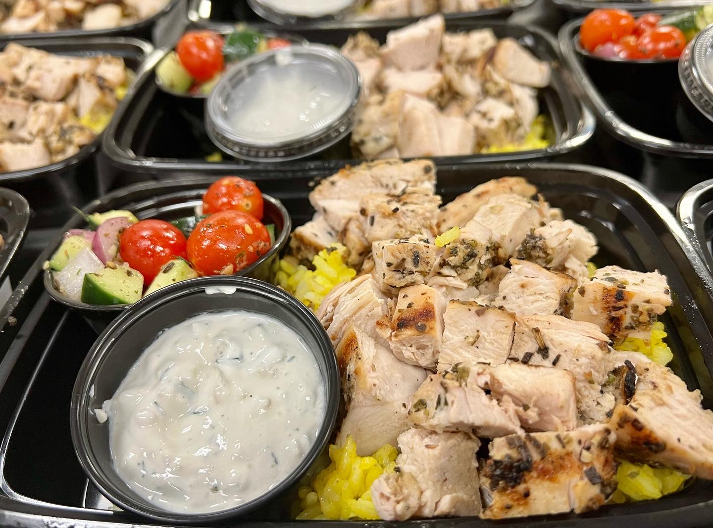 Mediterranean grilled chicken bowl with turmeric rice, Greek salad & side of tzatziki (GF)