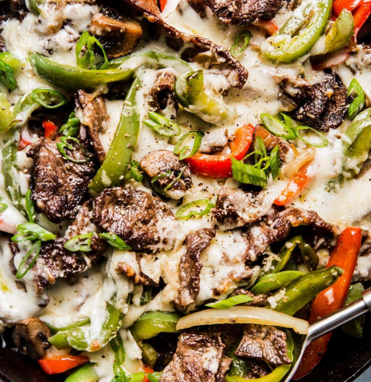 Deconstructed ground beef Philly cheesesteak with steamed rice & green beans (Gluten-free)